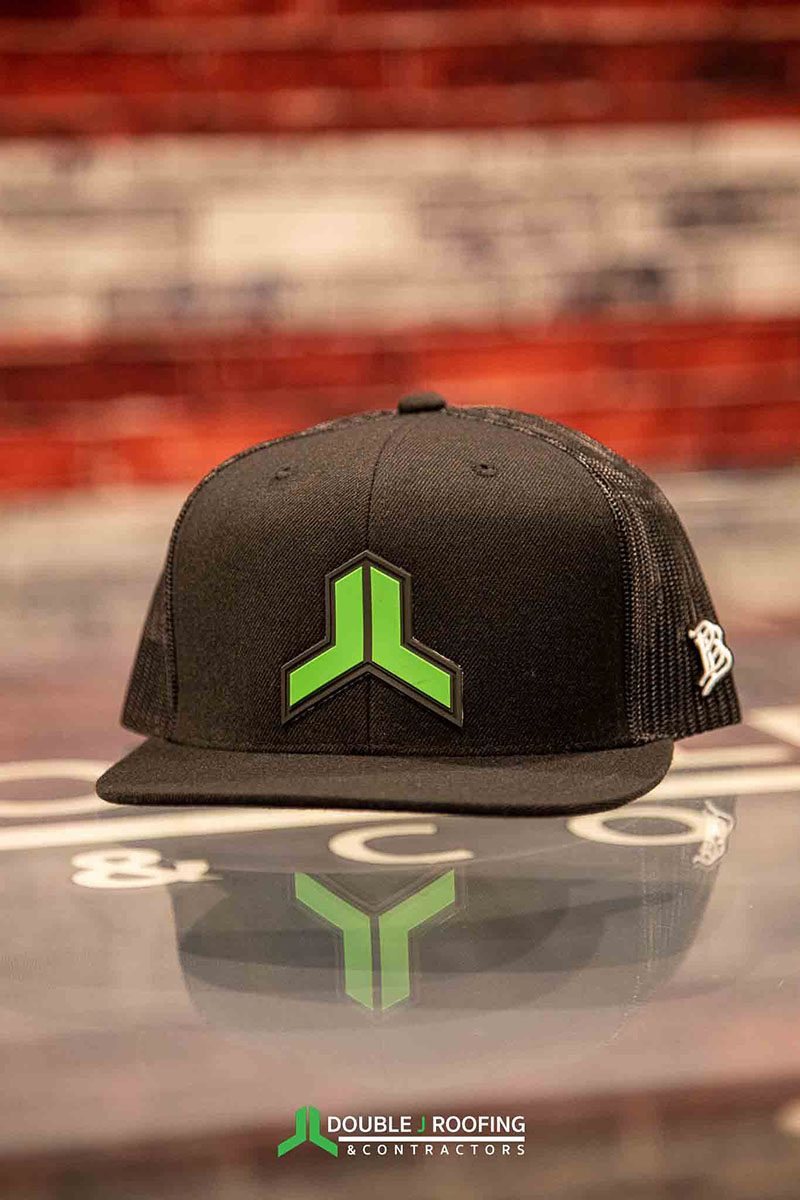 Dark gray hat with Double J logo icon in its normal green color
