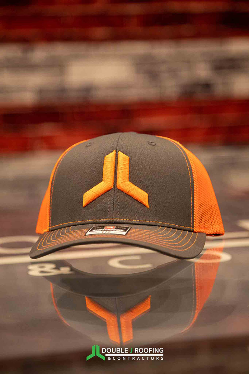 Light gray and orange hat with orange Double J logo icon stitched on